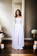 Regal Allure: White Satin Circular Flared Gown with Beaded Illusion Neckline, Net Full Sleeves, Pearl & Sequin Embellishments, and Cowl Draped Front