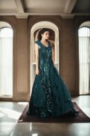 Luxurious Bottle Green Sequin Ball Gown with Illusion Neckline, Cascading Shoulders, A-Line Sequin Bottom, Half-Neck Net Frill Sleeveless, and Net Plain Dupatta with Sequin Border - Perfect for Weddings & Grand Events