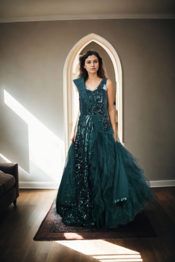 Luxurious Bottle Green Sequin Ball Gown with Illusion Neckline, Cascading Shoulders, A-Line Sequin Bottom, Half-Neck Net Frill Sleeveless, and Net Plain Dupatta with Sequin Border - Perfect for Weddings & Grand Events