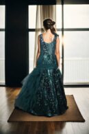 Luxurious Bottle Green Sequin Ball Gown with Illusion Neckline, Cascading Shoulders, A-Line Sequin Bottom, Half-Neck Net Frill Sleeveless, and Net Plain Dupatta with Sequin Border - Perfect for Weddings & Grand Events