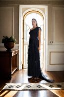 Black Net One-Shoulder Gown with Stretch Design, Ruffled Draped Detailing, and Front Slit - Elegant Evening Wear