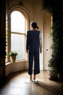Black Crepecare Self-Design Asymmetric Jumpsuit with V-Neck, Golden Sequin Drape, Long Sleeves, and Two Pockets - Elegant Evening Wear